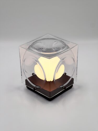 studio shot of the Lee Broom Chant Portable Table Lamp in Clear Bronze