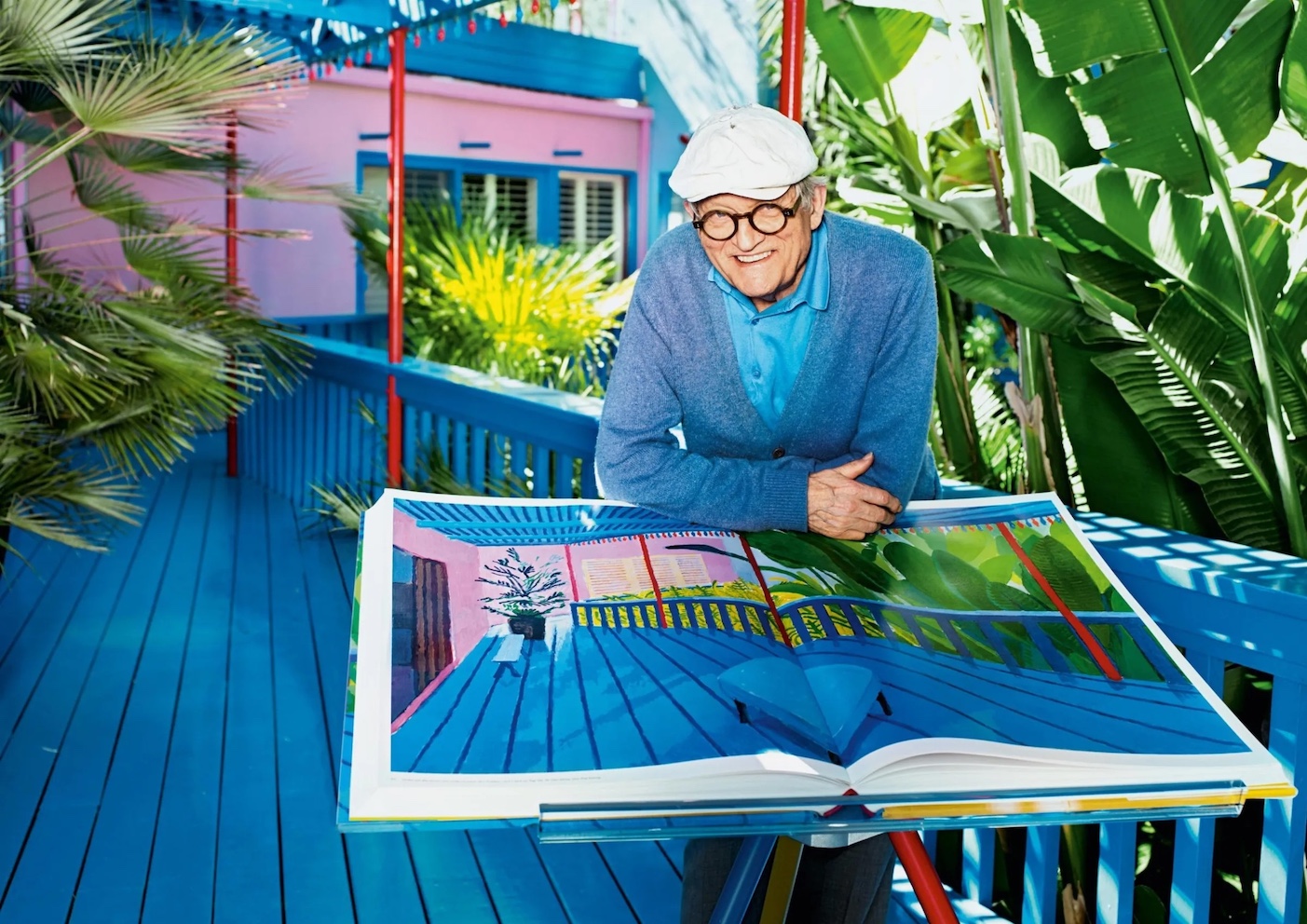 Picture of David Hockney with his book "David Hockney - A Bigger Book", Collector's Edition, with a Marc Newson bookstand